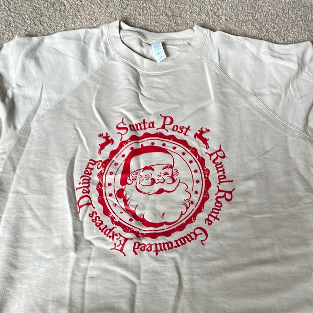 Cream/tan crewneck Sweatshirt with Red Santa Graphic